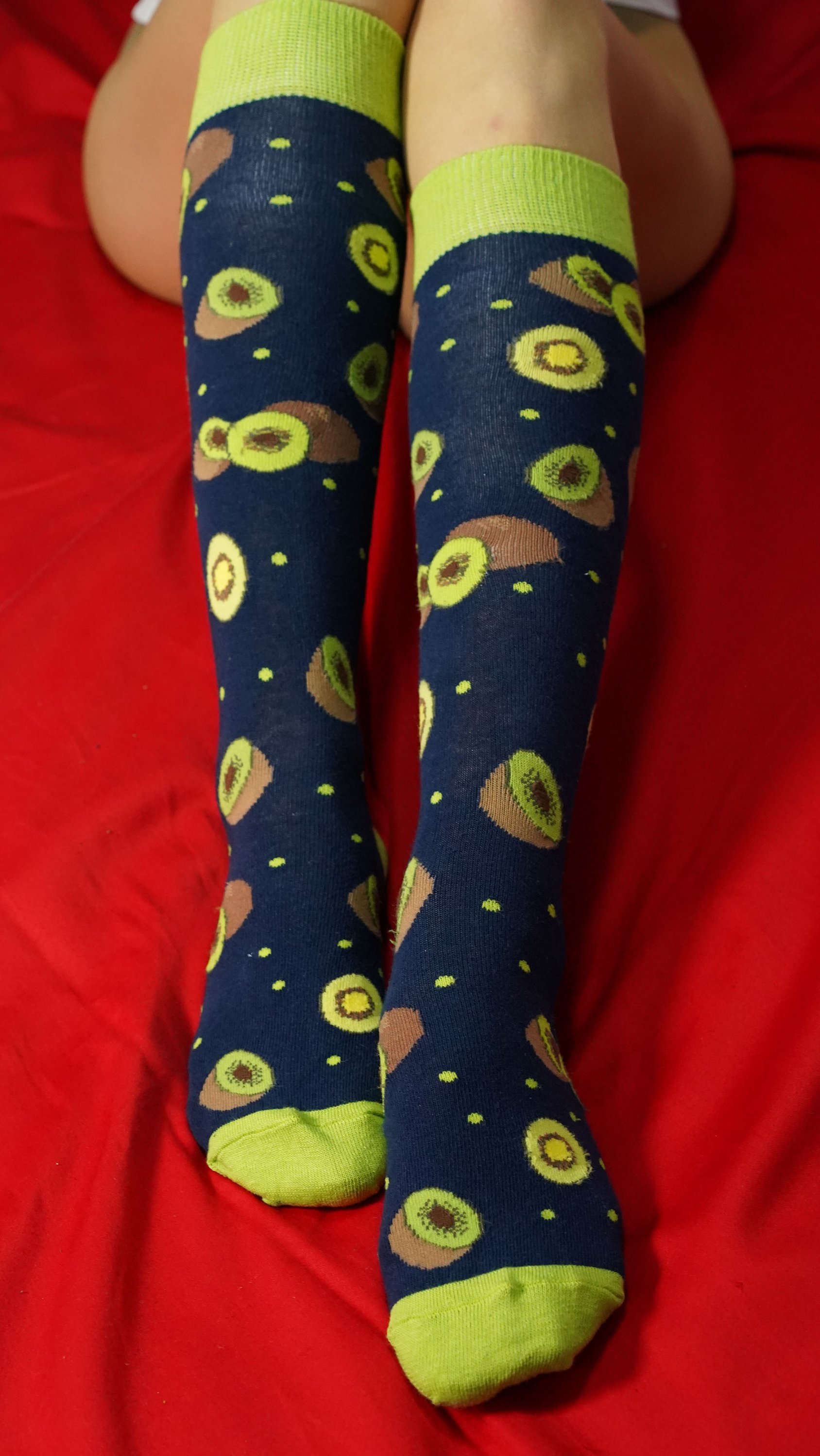 A vibrant set of Women's Delightful Fruits Knee High Socks featuring colorful fruit patterns, perfect for adding style and comfort to any outfit.