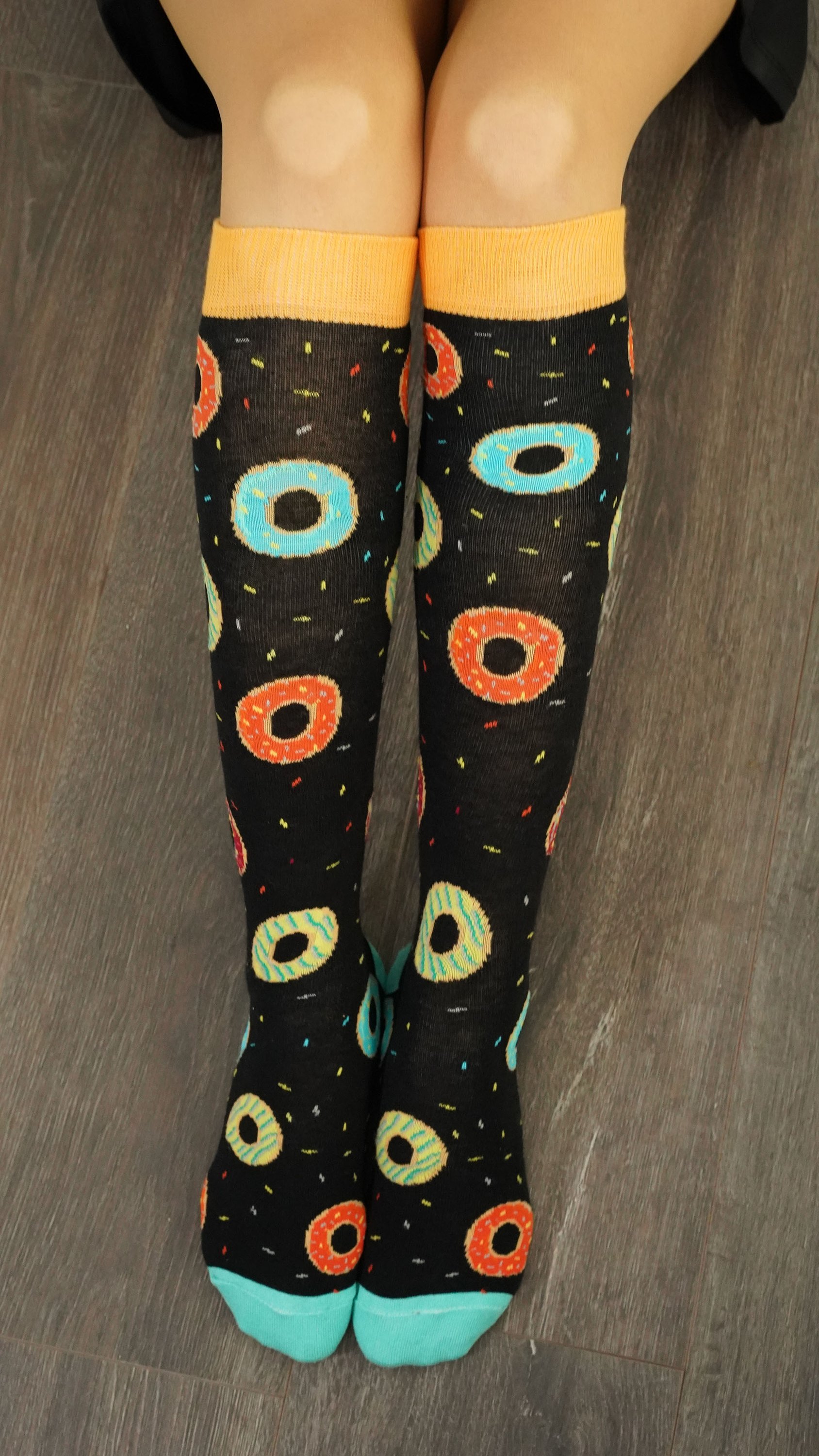 Colorful Women's Donuts Knee High Socks featuring a fun donut pattern, perfect for adding a playful touch to any outfit.