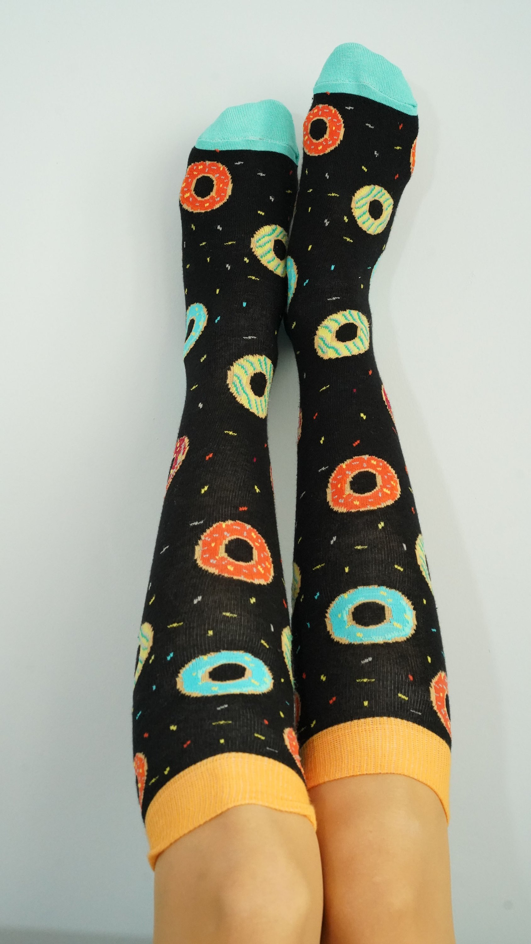Colorful Women's Donuts Knee High Socks featuring a fun donut pattern, perfect for adding a playful touch to any outfit.
