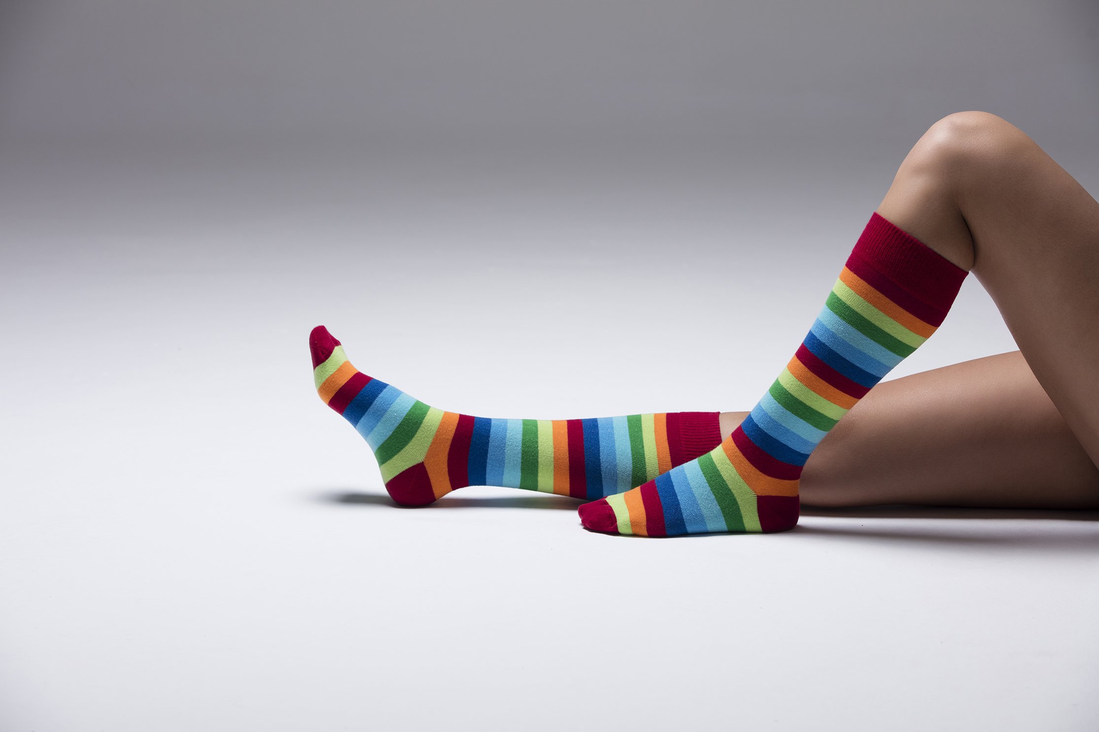 A vibrant set of women's knee-high socks featuring colorful stripes, made from soft Turkish cotton for comfort and style.