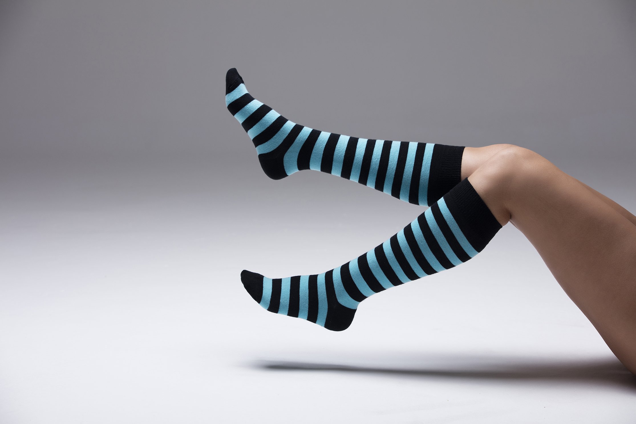 A vibrant set of women's knee-high socks featuring colorful stripes, made from soft Turkish cotton for comfort and style.