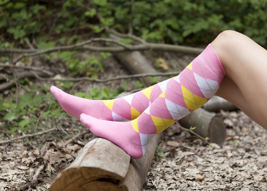 A colorful set of Women's Mixed & Match Argyle Knee High Socks featuring trendy patterns and soft fabric, perfect for stylish comfort.