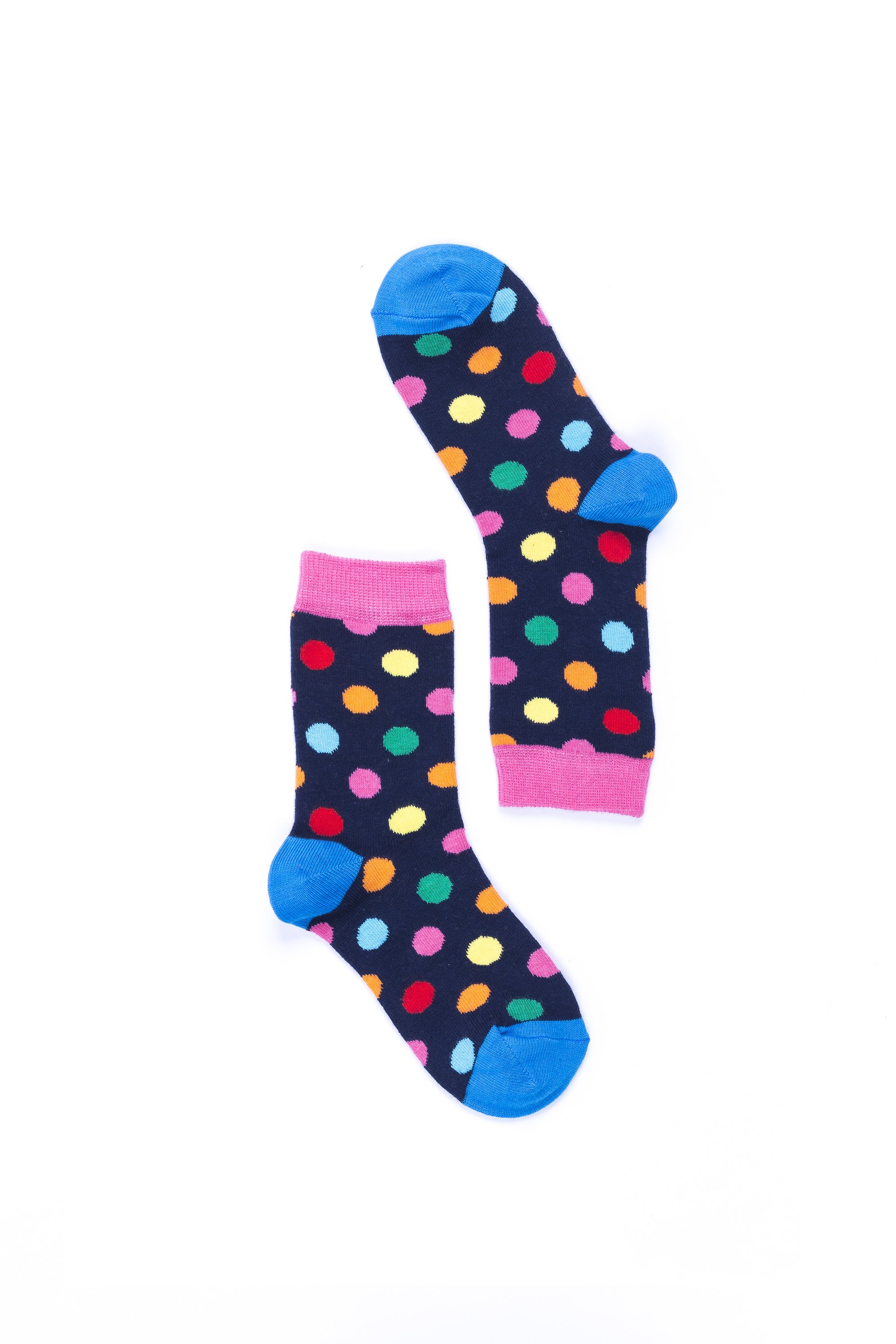 A pair of Women's Pink Sky Dot Socks featuring a vibrant pink color with playful dot patterns, made from soft Turkish cotton.