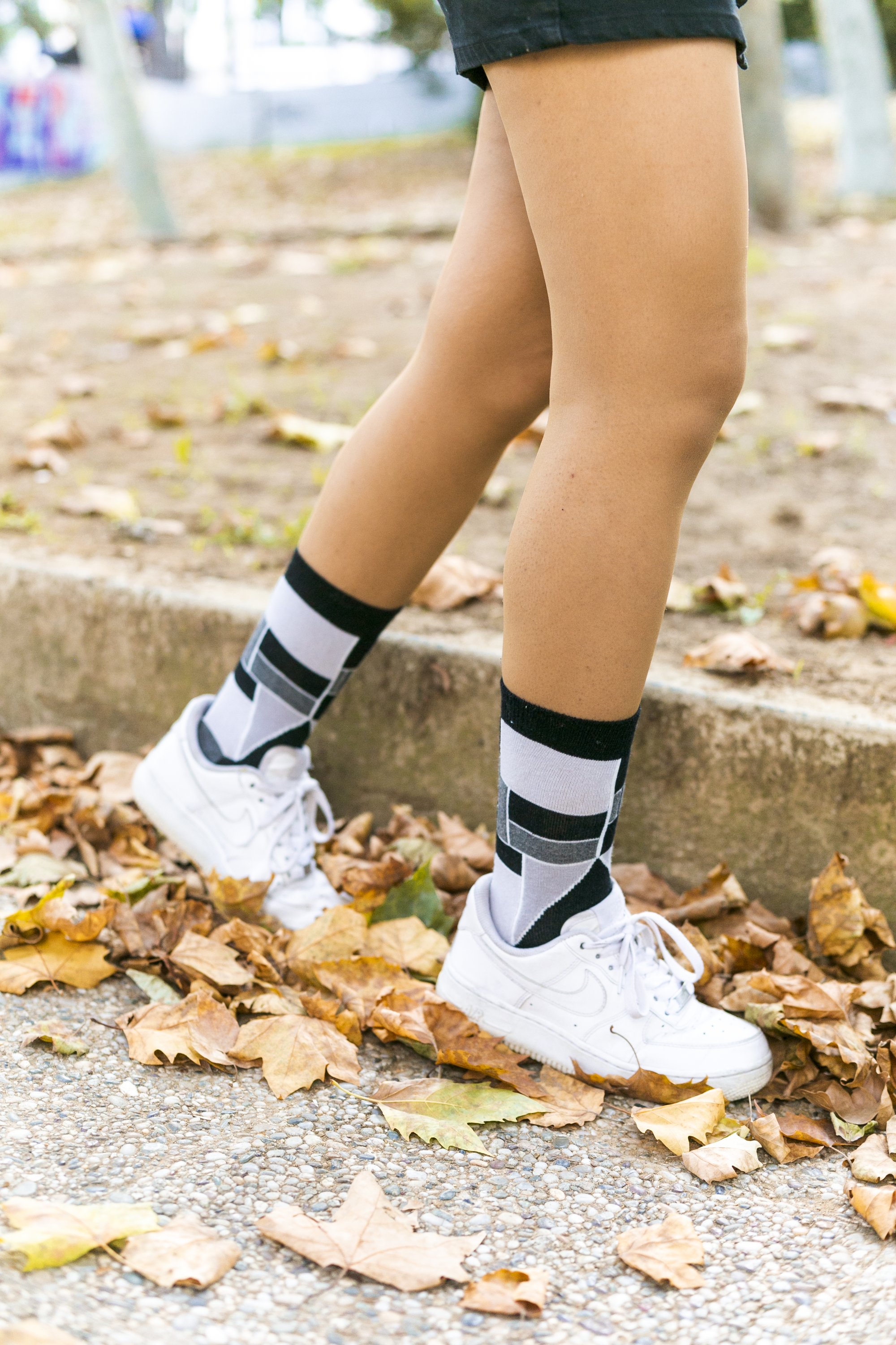 A pair of Women's Stone Cube Socks featuring colorful patterns and a soft texture, perfect for adding style and comfort to any outfit.