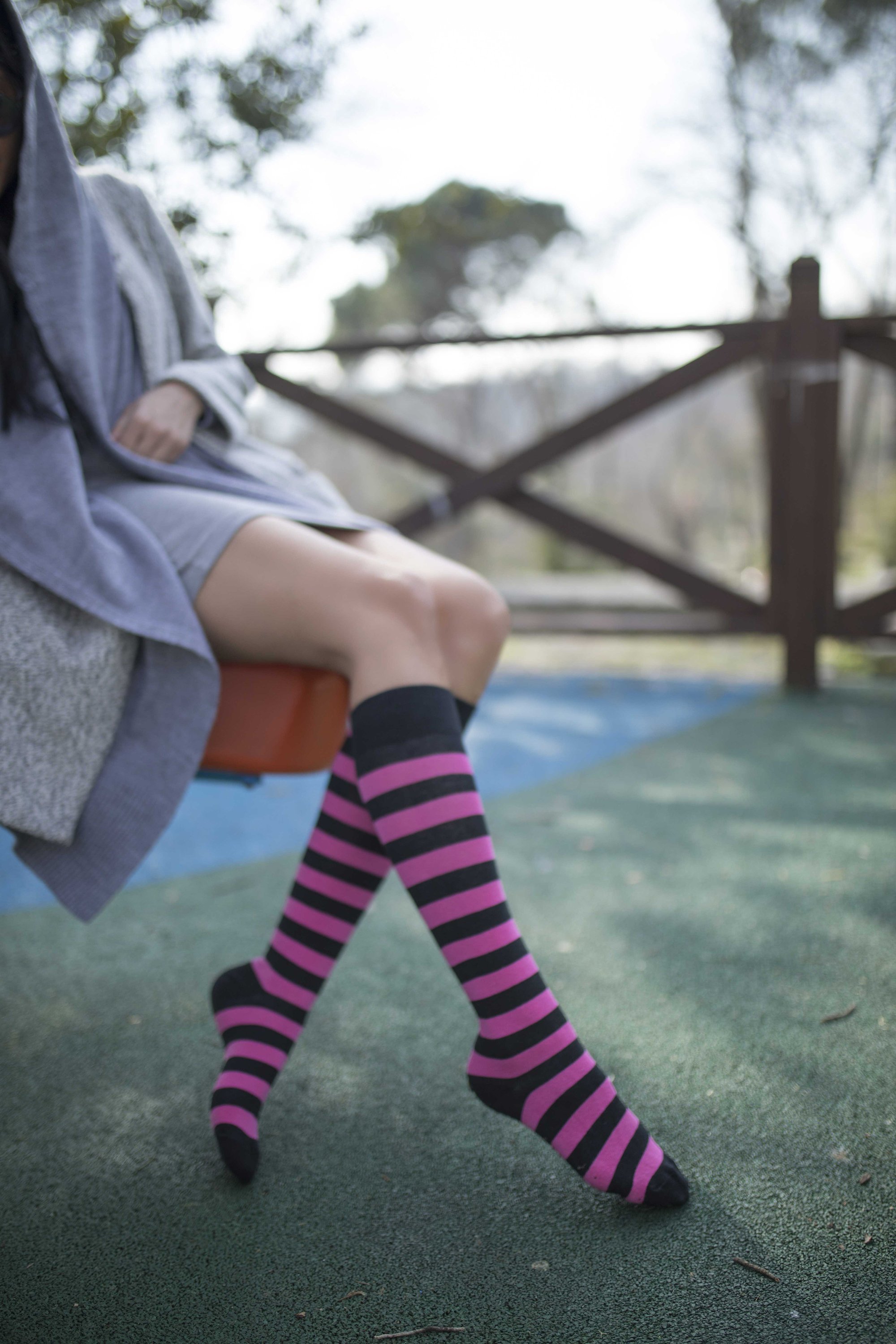 A vibrant set of women's knee-high socks featuring stylish stripes in various colors, perfect for adding flair to any outfit.