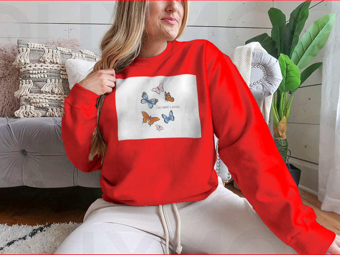 A vibrant sweatshirt featuring a colorful butterfly design, made from soft cotton fabric, showcasing a classic fit and midweight construction.