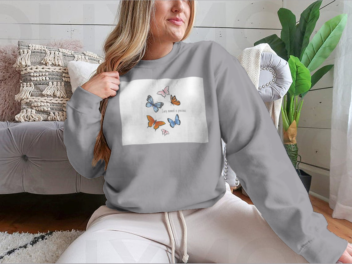 A vibrant sweatshirt featuring a colorful butterfly design, made from soft cotton fabric, showcasing a classic fit and midweight construction.