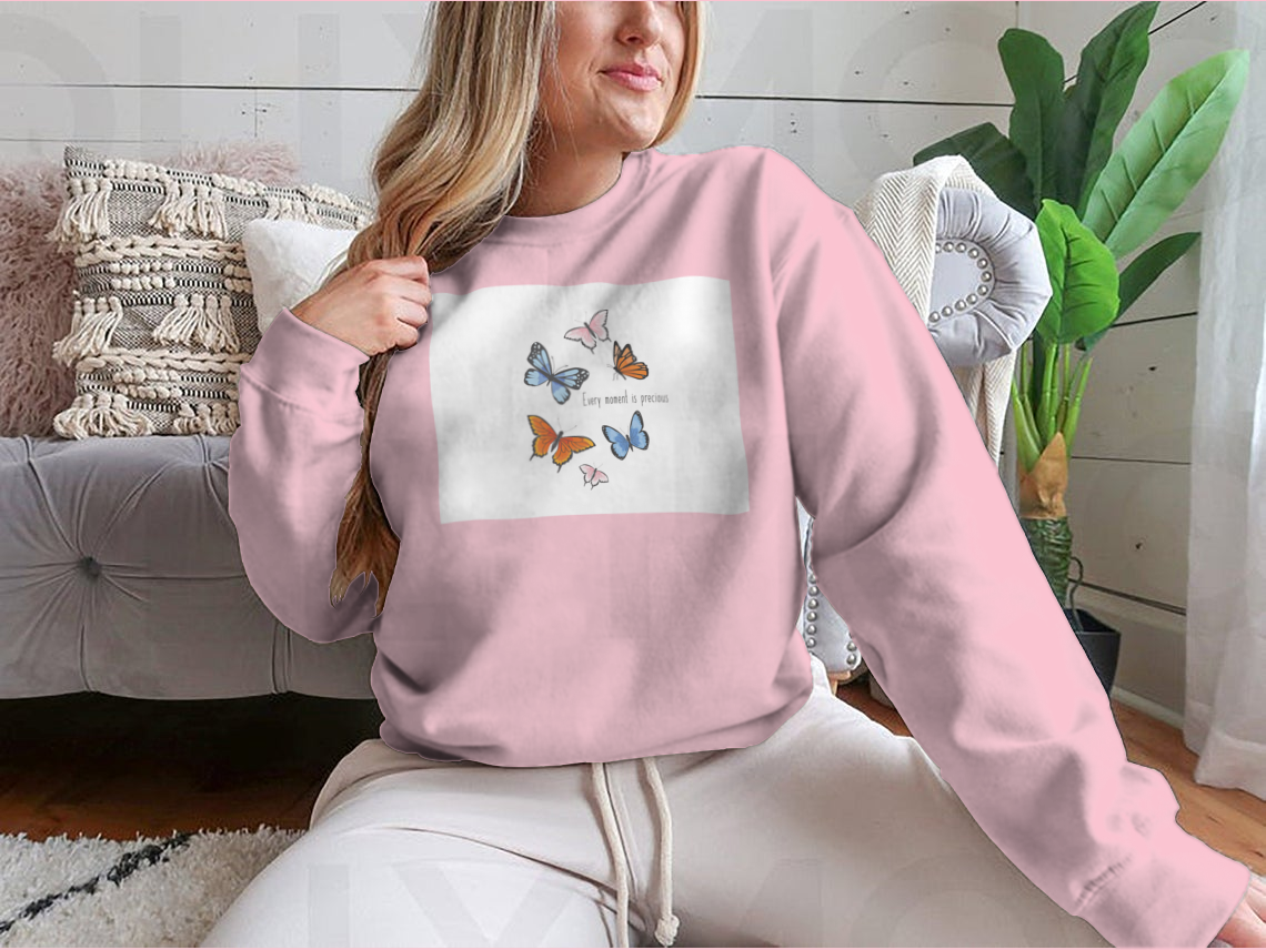 A vibrant sweatshirt featuring a colorful butterfly design, made from soft cotton fabric, showcasing a classic fit and midweight construction.