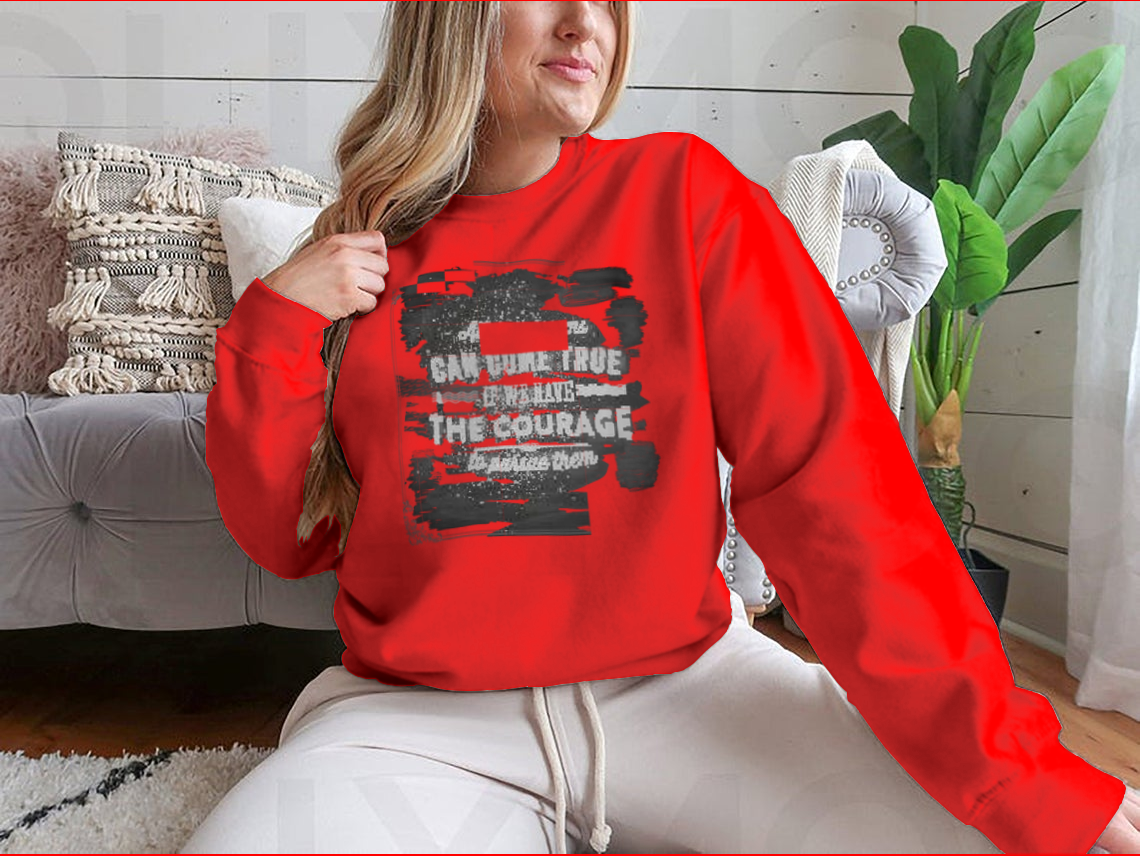 A motivational shirt featuring the quote 'All Our Dreams Can Come True If We Have The Courage To Pursue Them', made from a soft cotton/polyester blend.