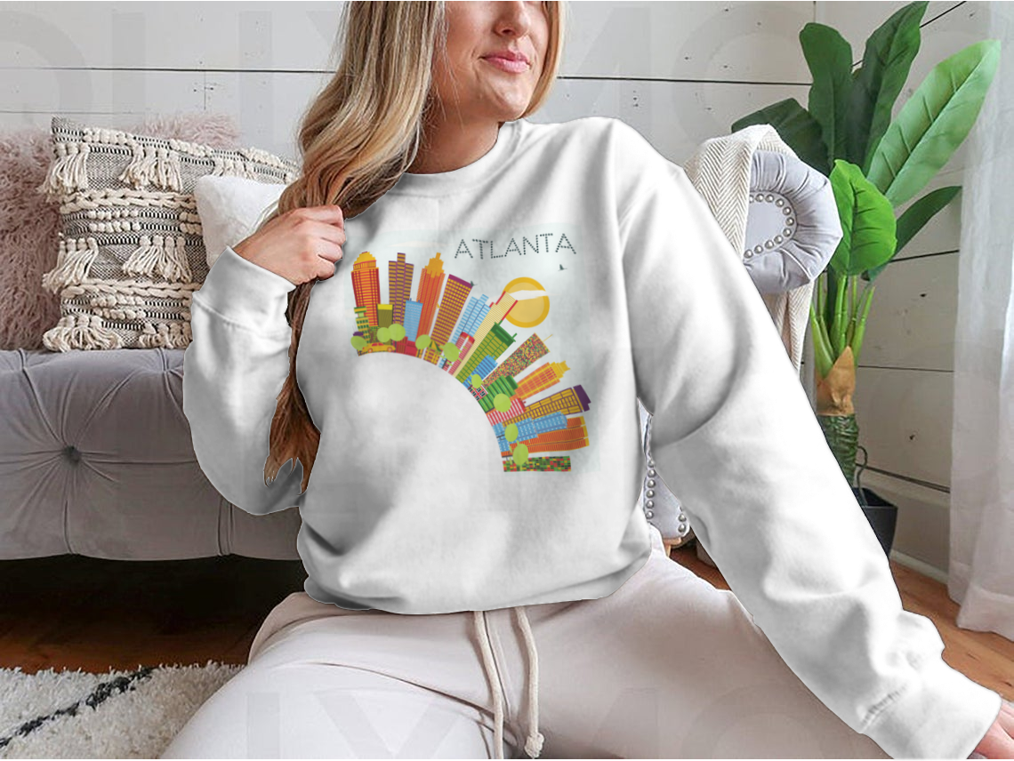 Vibrant artwork of the Atlanta skyline featuring colorful buildings against a clear blue sky, ideal for home or office decor.