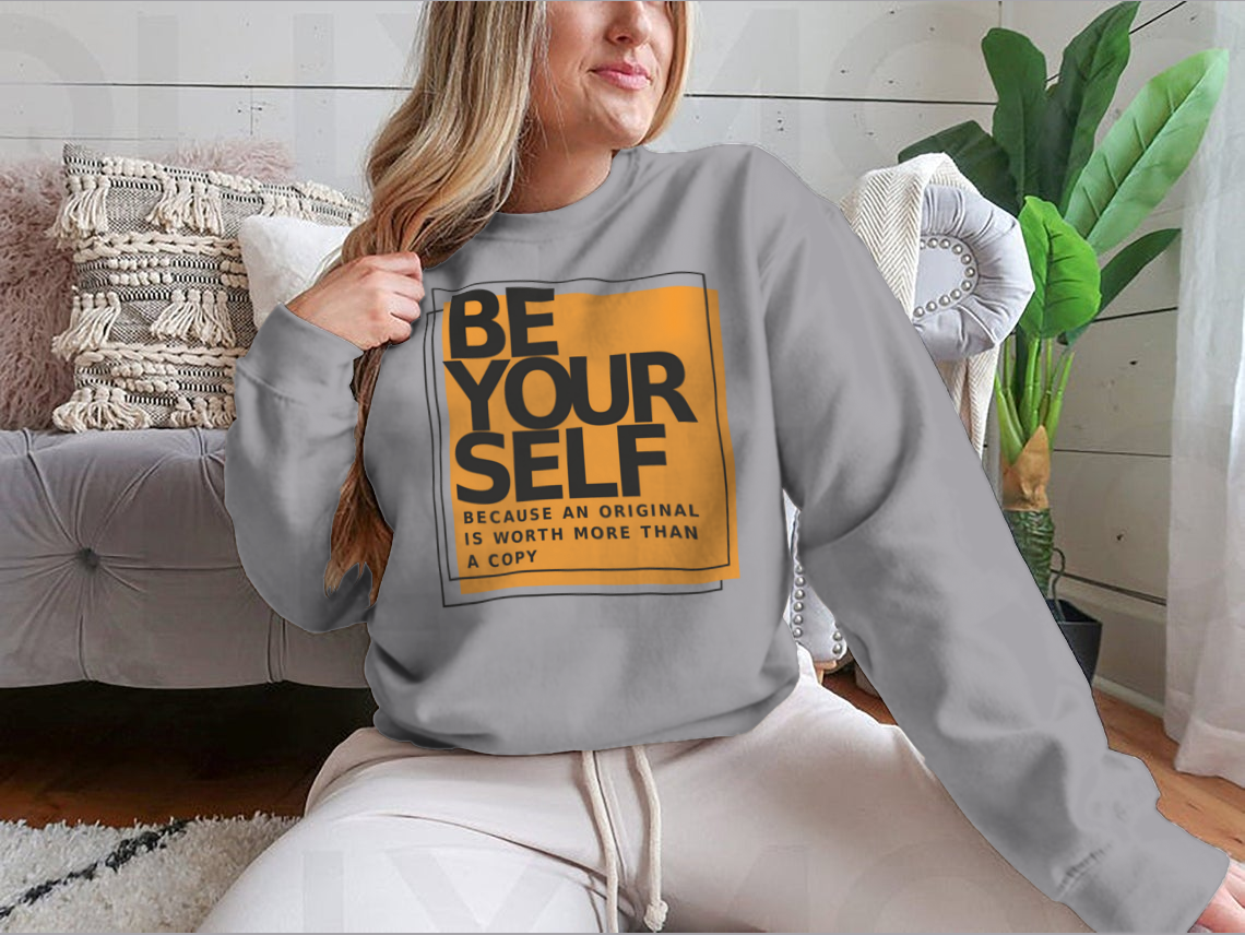 A stylish cotton shirt featuring the phrase 'Be Yourself Because An Original Is Worth More Than A Copy' in a bold design, perfect for casual wear.