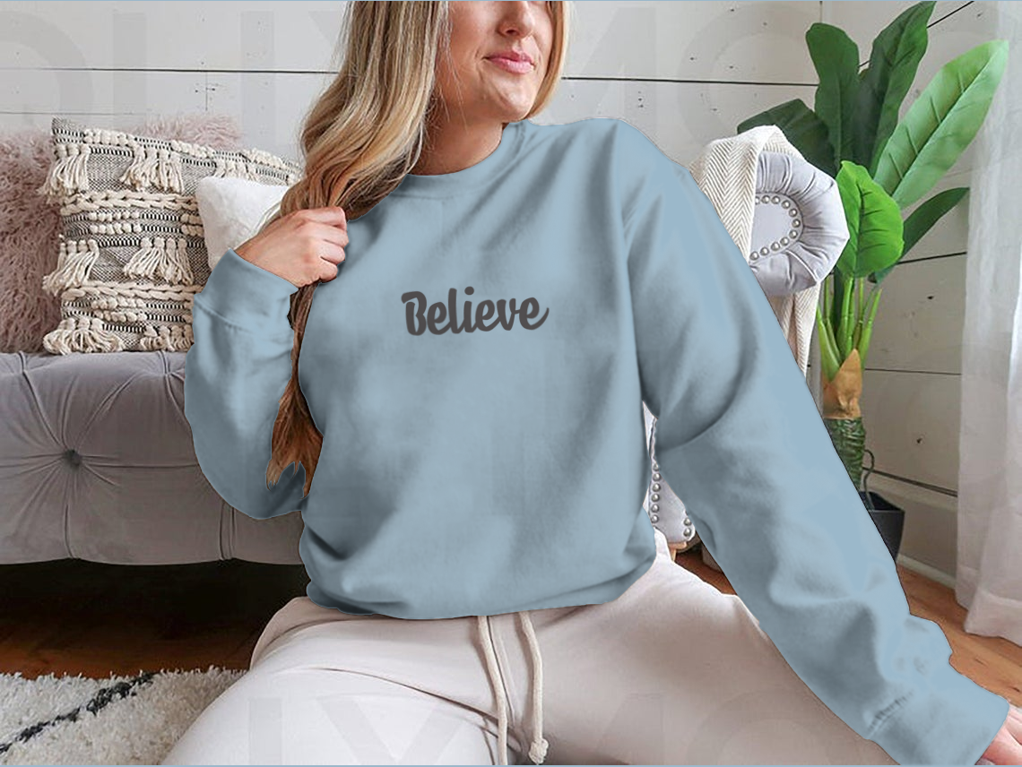 Believe Word Lettering t-shirt featuring hand-drawn typography in a stylish design.