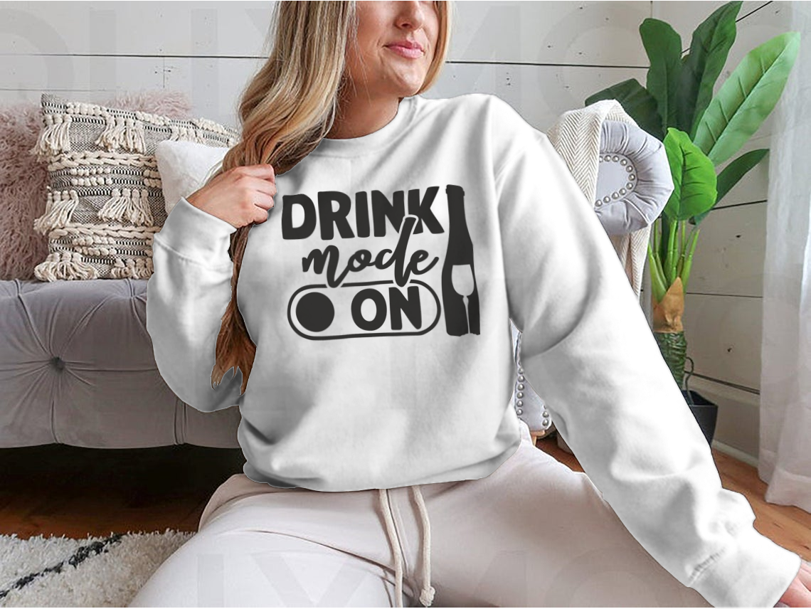 A stylish sweatshirt featuring the phrase 'Drink Mode On', made from soft cotton fabric, perfect for casual wear.
