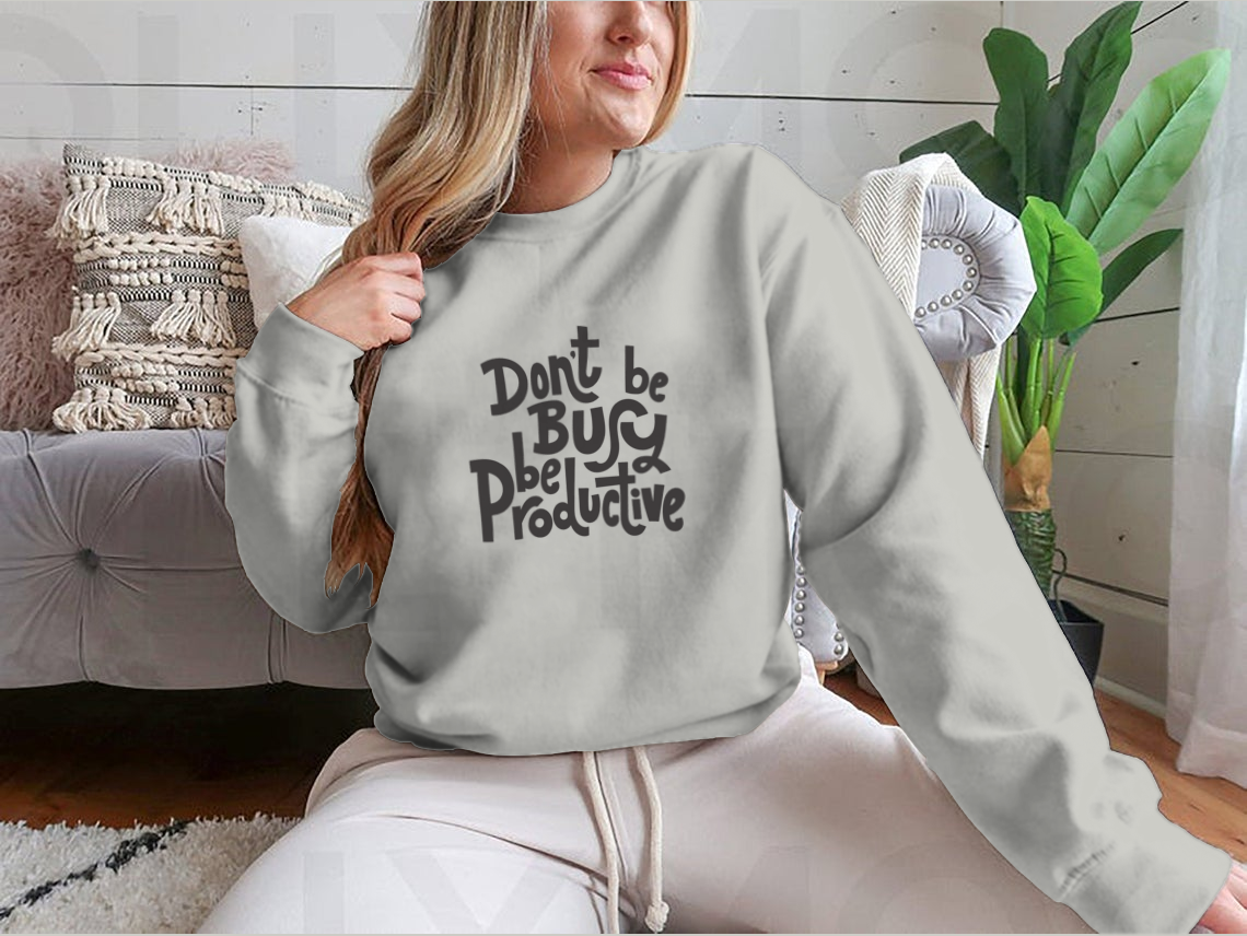 A stylish sweatshirt featuring the phrase 'Don't Be Busy, Be Productive' in a comfortable fit, made from a cotton/polyester blend.