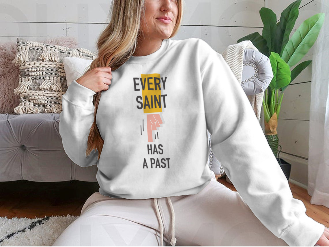 Every Saint Has A Past motivational quote sweatshirt featuring a classic fit and soft fabric blend.