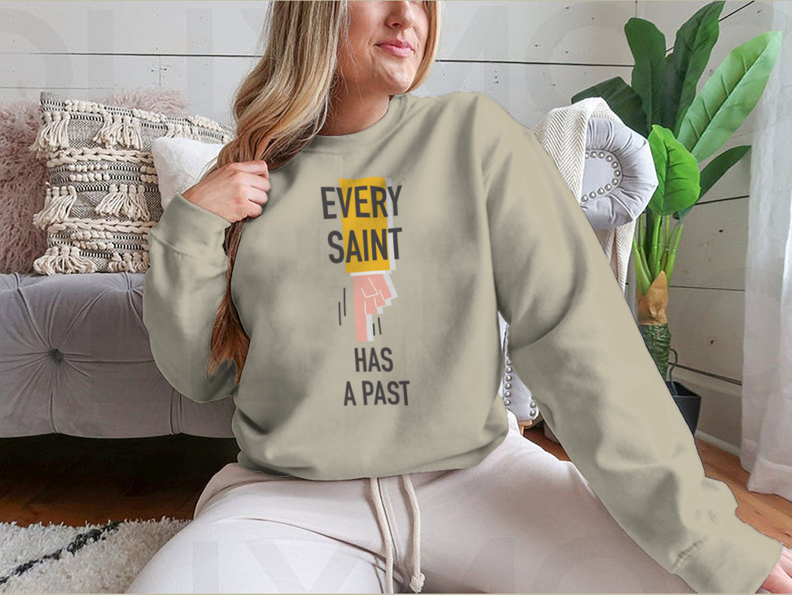 Every Saint Has A Past motivational quote sweatshirt featuring a classic fit and soft fabric blend.