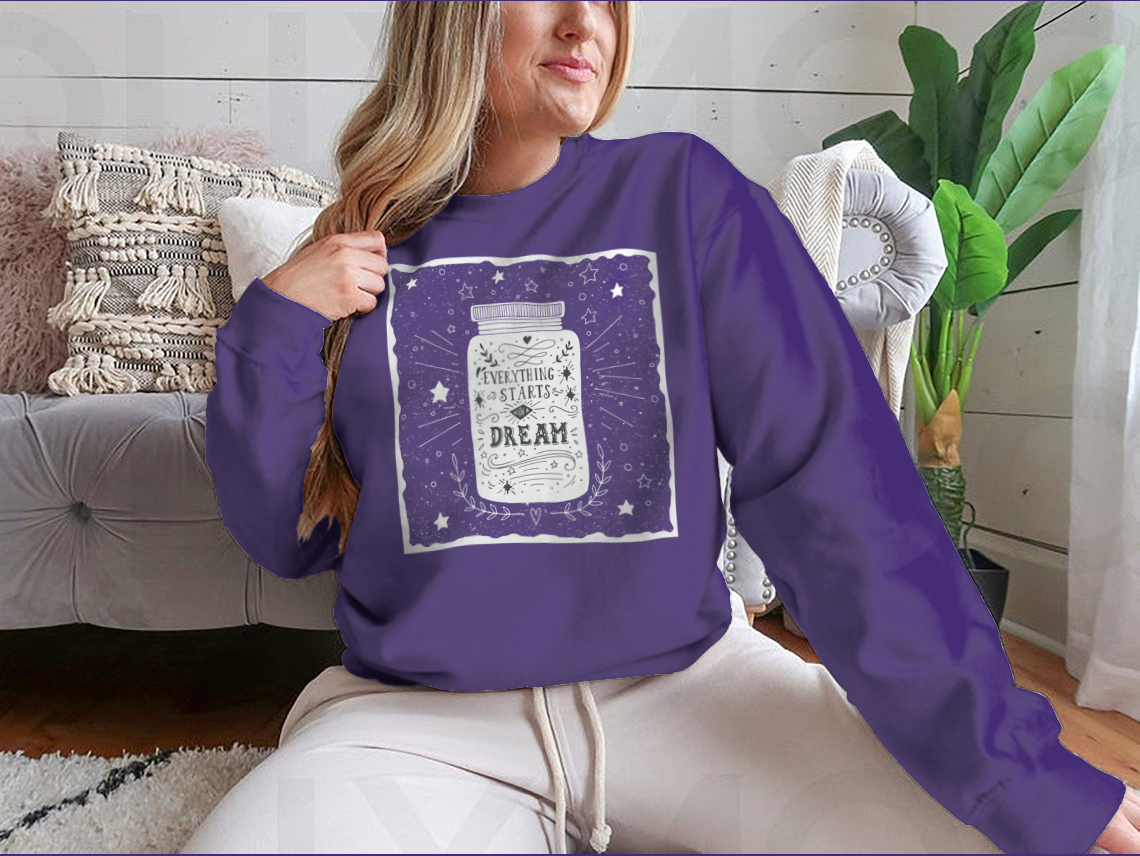 A stylish t-shirt featuring the hand-drawn quote 'Everything Starts With A Dream' in an inspiring design, showcasing a comfortable fit.