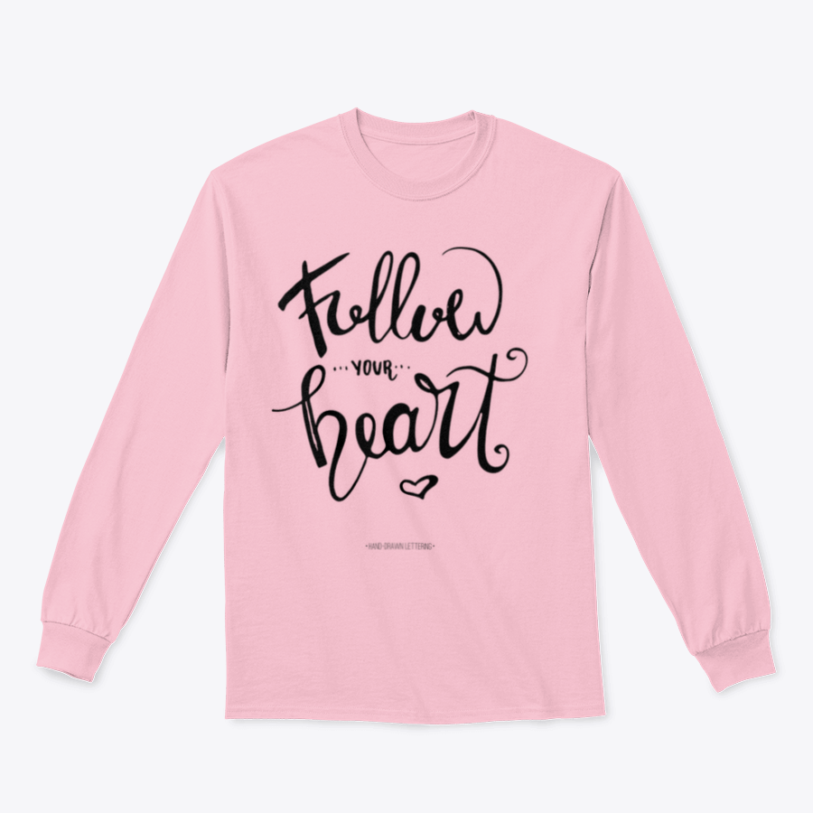 A stylish apparel featuring modern brush hand-drawn ink calligraphy saying 'Follow Your Heart' with a heart symbol, showcasing a blend of cotton and polyester.