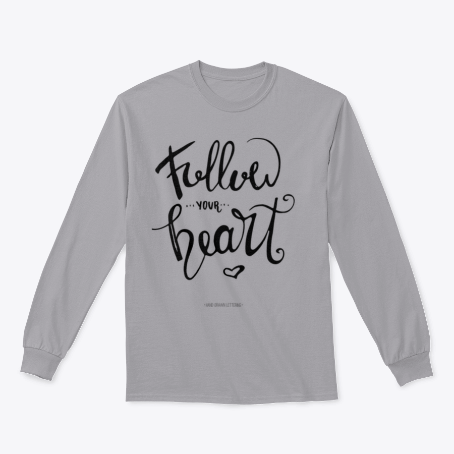 A stylish apparel featuring modern brush hand-drawn ink calligraphy saying 'Follow Your Heart' with a heart symbol, showcasing a blend of cotton and polyester.