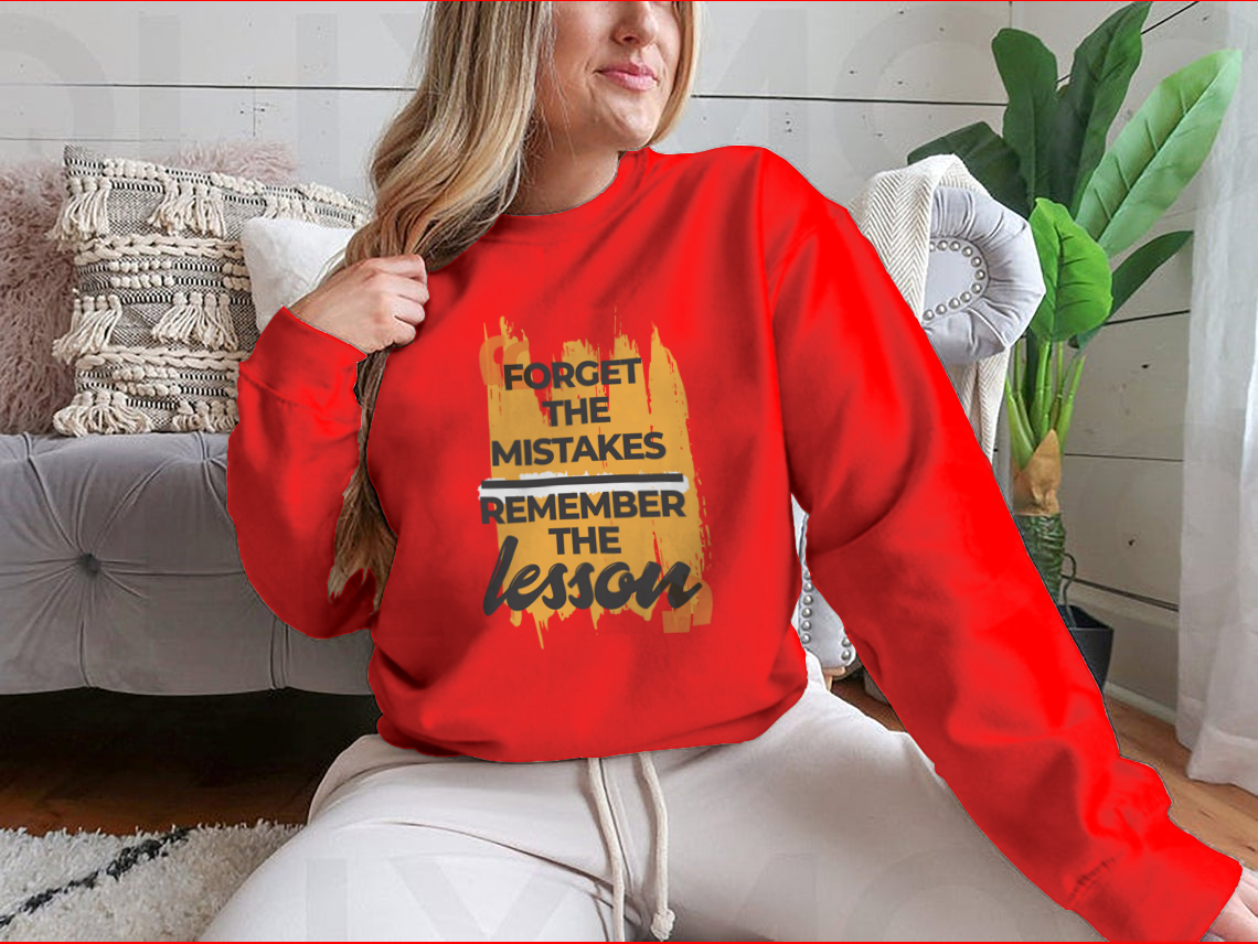 A stylish sweatshirt featuring the phrase 'Forget The Mistakes Remember', made from a comfortable cotton/polyester blend.