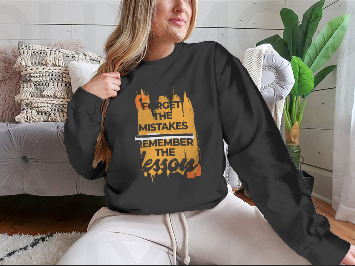 A stylish sweatshirt featuring the phrase 'Forget The Mistakes Remember', made from a comfortable cotton/polyester blend.