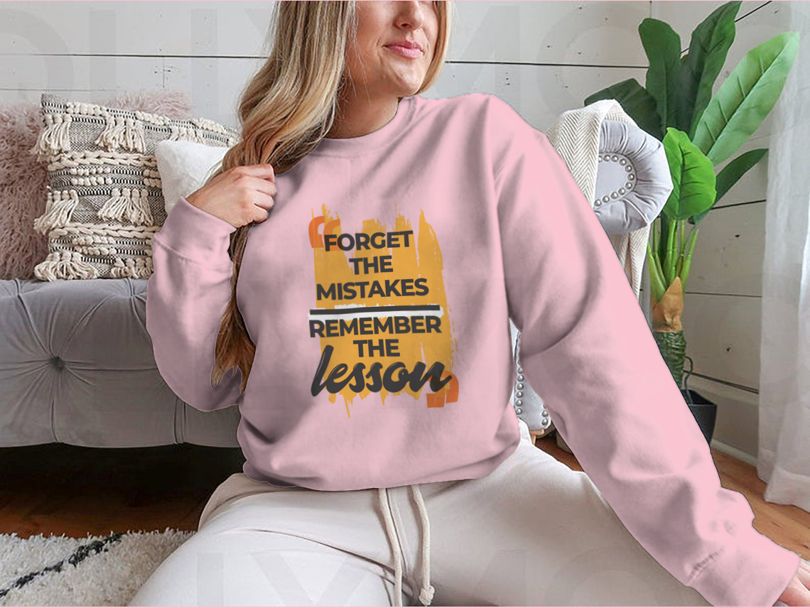A stylish sweatshirt featuring the phrase 'Forget The Mistakes Remember', made from a comfortable cotton/polyester blend.
