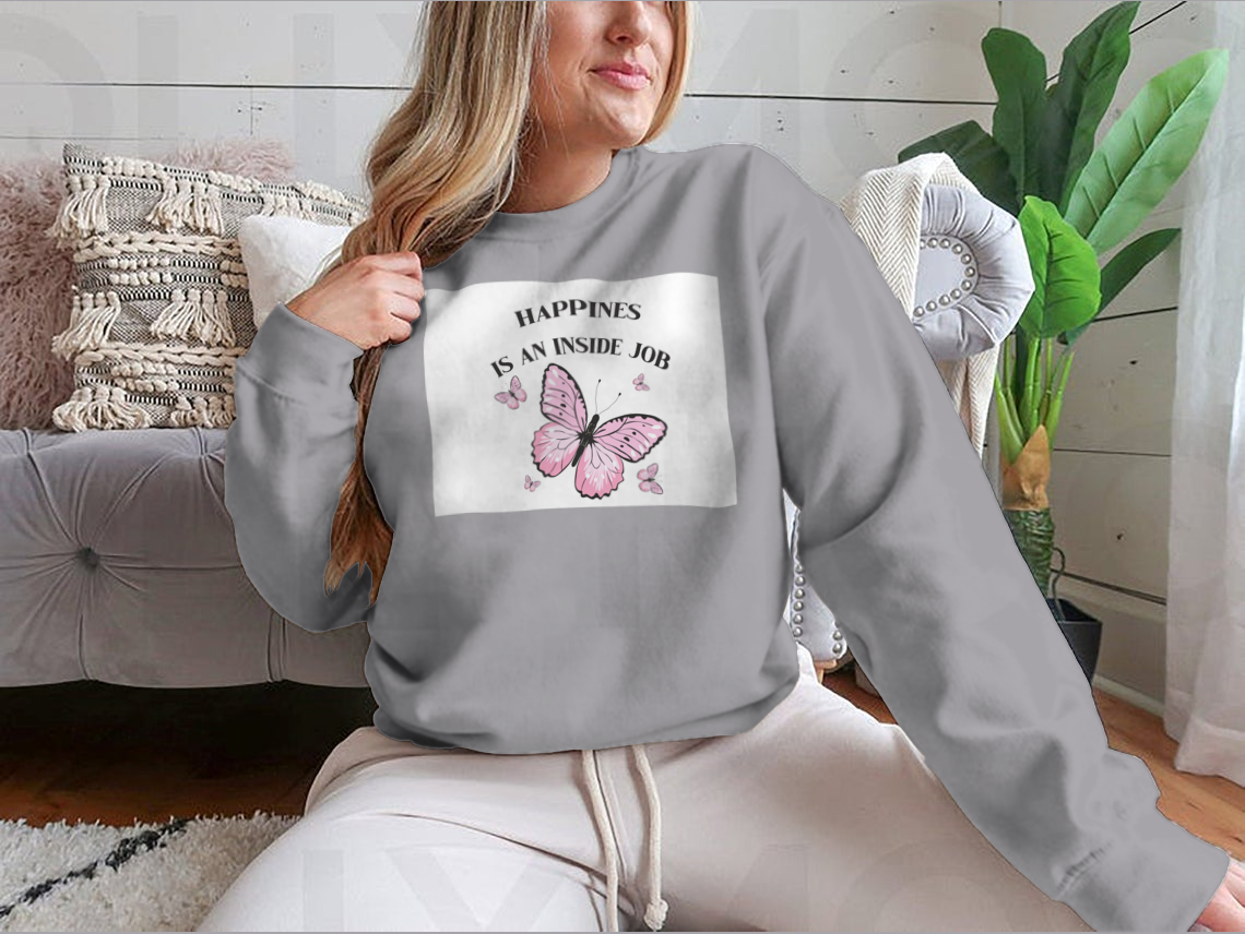 A stylish shirt featuring a pink butterflies design with the phrase 'Happiness Is An Inside Job', made from soft cotton fabric.