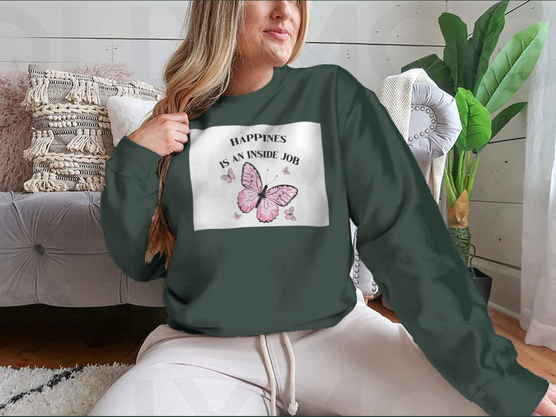 A stylish shirt featuring a pink butterflies design with the phrase 'Happiness Is An Inside Job', made from soft cotton fabric.
