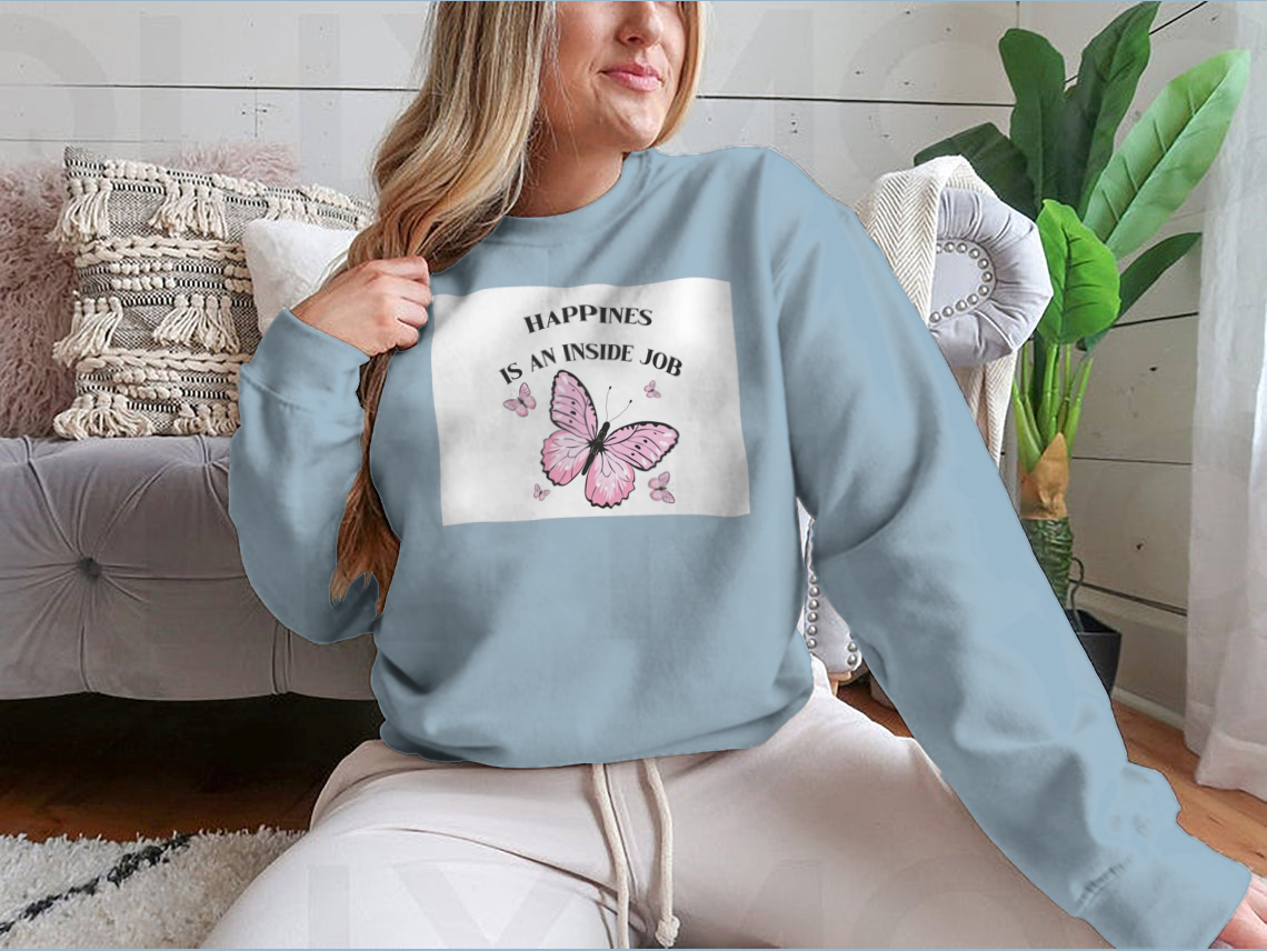 A stylish shirt featuring a pink butterflies design with the phrase 'Happiness Is An Inside Job', made from soft cotton fabric.