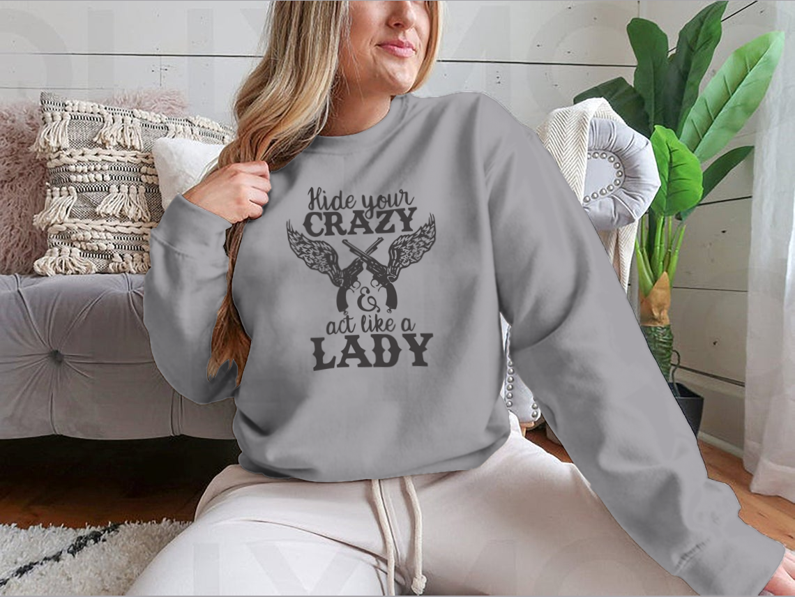 A cozy sweatshirt featuring the phrase 'Hide Your Crazy And Act Like A Lady' in a stylish font, perfect for casual wear.