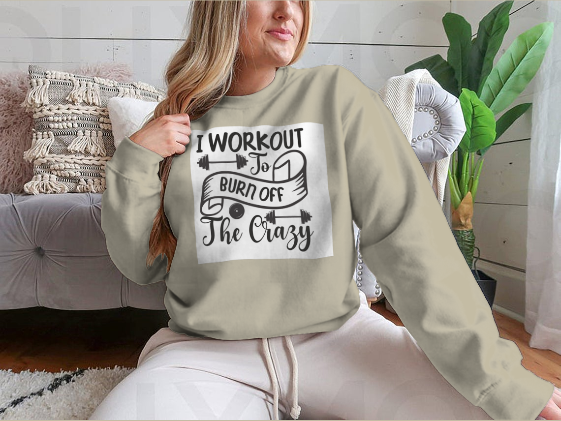 A stylish sweatshirt featuring the phrase 'I Workout To Burn Off The Crazy', made from soft cotton fabric, perfect for fitness enthusiasts.