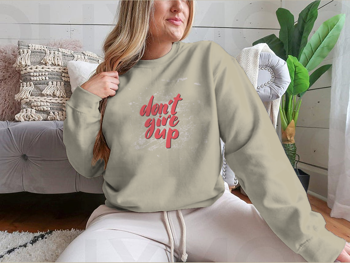 A stylish motivational quote design featuring 'Don't Give Up' on a comfortable cotton/polyester blend fabric, perfect for inspiring positivity.