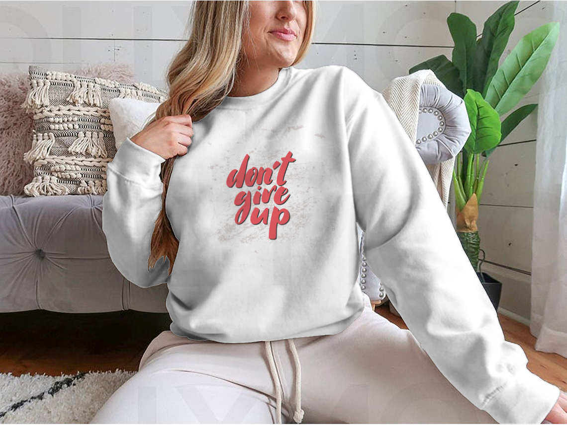 A stylish motivational quote design featuring 'Don't Give Up' on a comfortable cotton/polyester blend fabric, perfect for inspiring positivity.