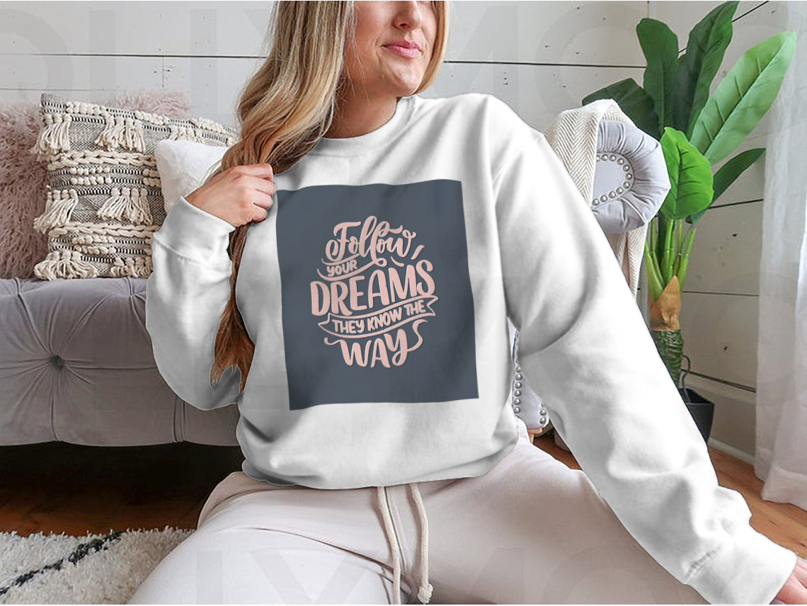 Hand-drawn vintage illustration featuring an inspirational quote about dreams on a soft cotton fabric.