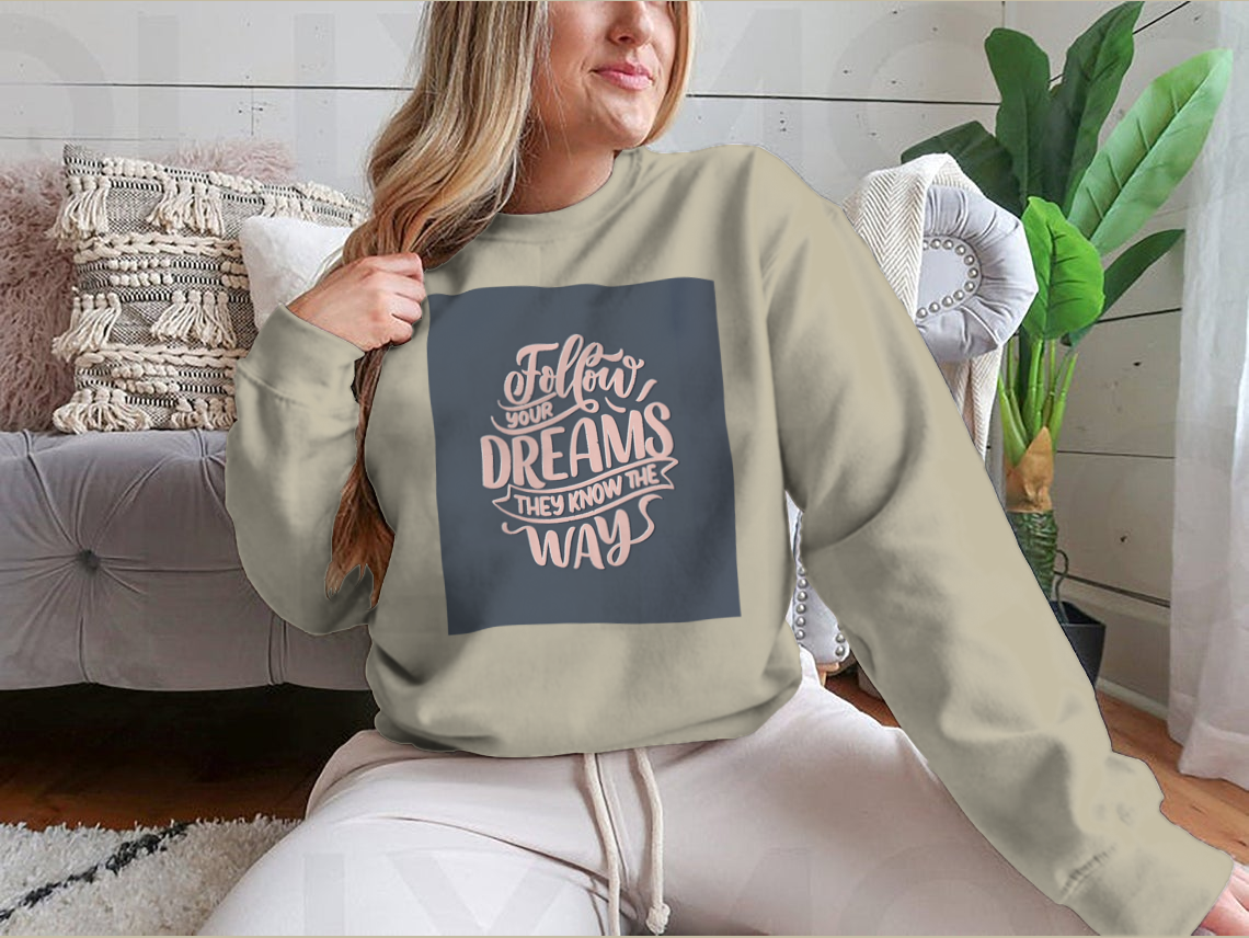 Hand-drawn vintage illustration featuring an inspirational quote about dreams on a soft cotton fabric.