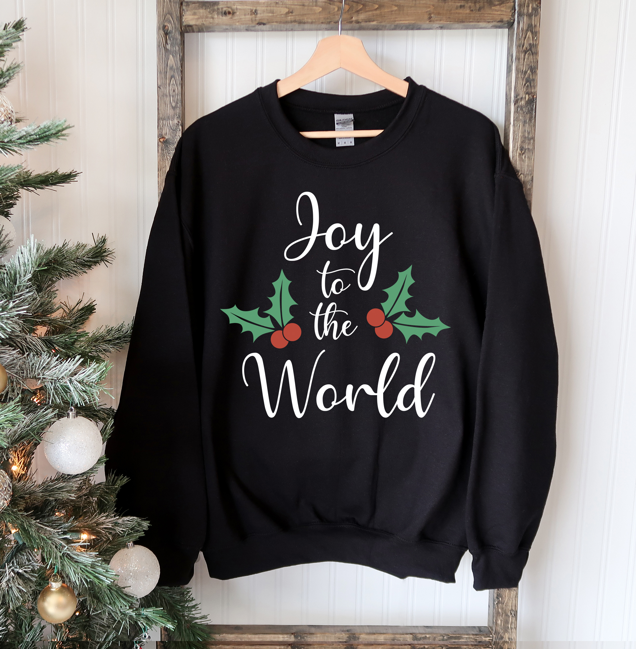 Joy To The World Christmas Sweatshirt featuring a crew neck design, soft fabric, and festive print, perfect for holiday celebrations.
