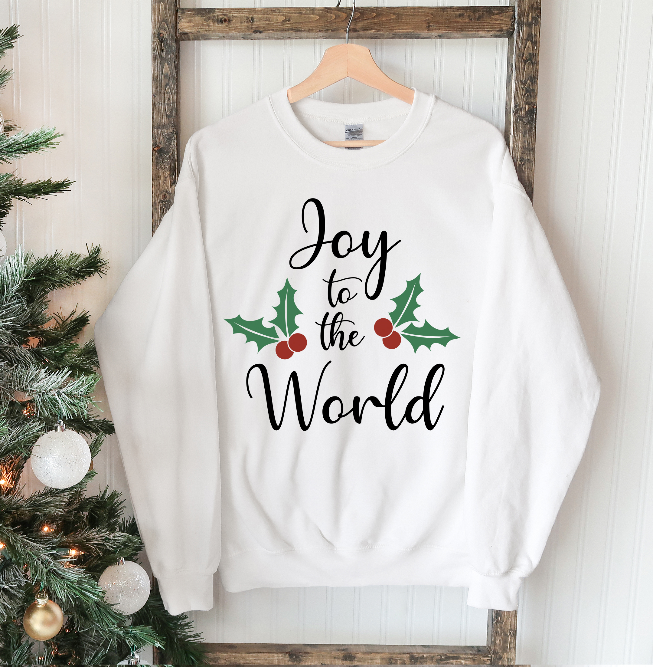 Joy To The World Christmas Sweatshirt featuring a crew neck design, soft fabric, and festive print, perfect for holiday celebrations.
