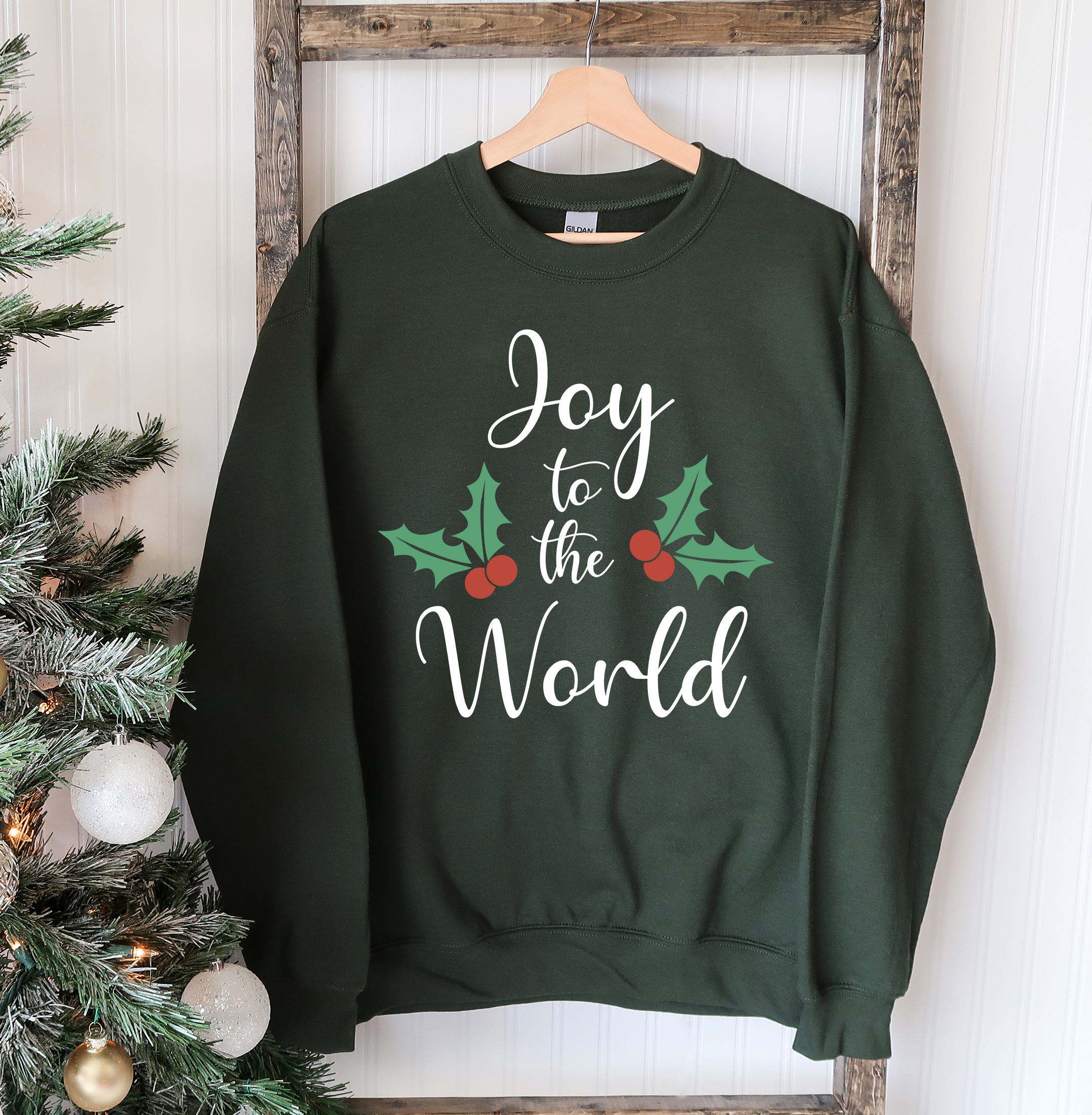 Joy To The World Christmas Sweatshirt featuring a crew neck design, soft fabric, and festive print, perfect for holiday celebrations.