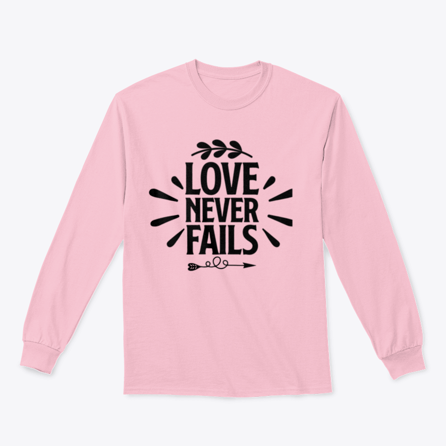 A collection of 'Love Never Fails' motivational T-shirts in various colors and sizes, showcasing their comfortable fabric and inspiring quotes.