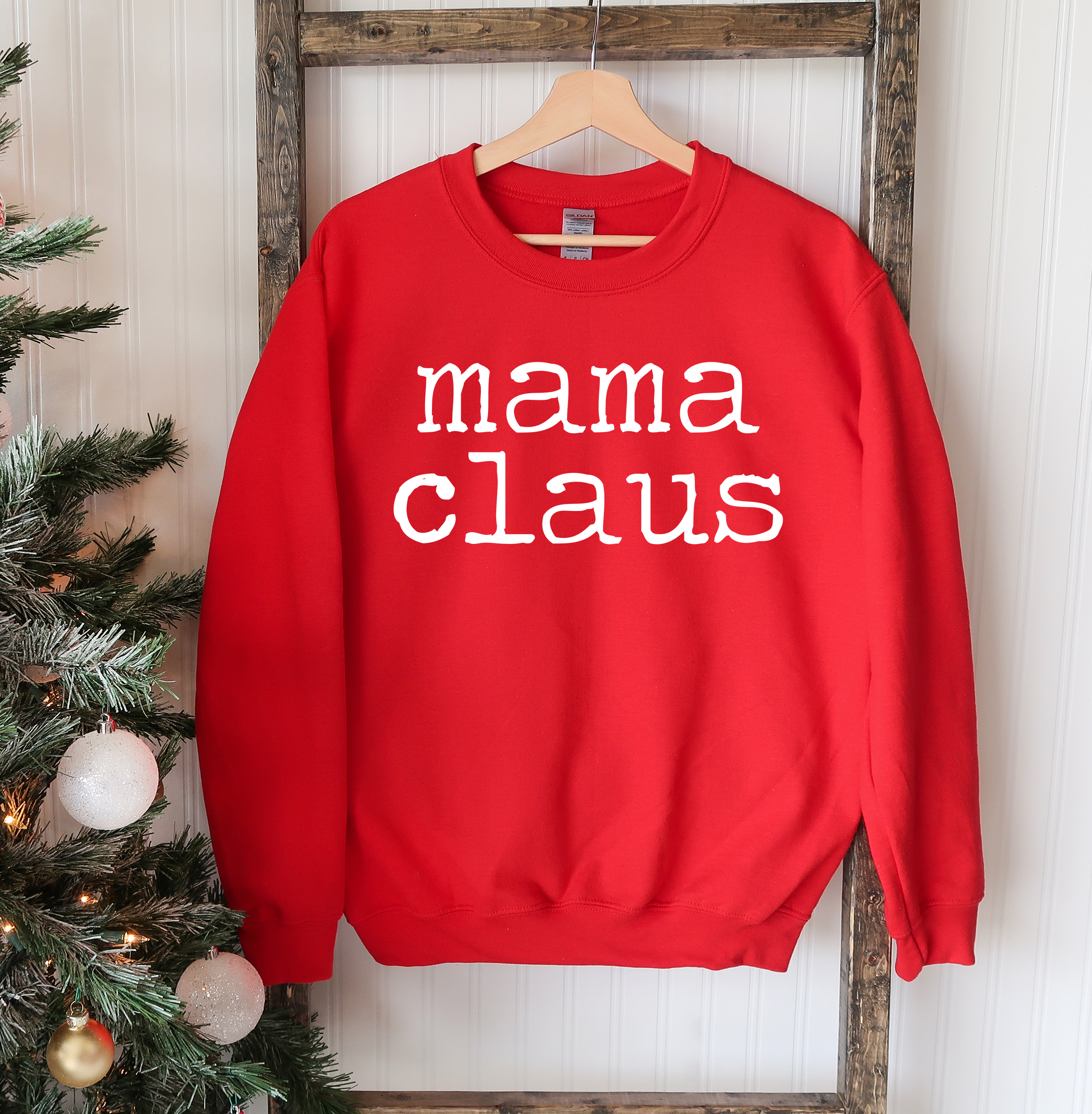 Mama Claus Christmas Sweatshirt featuring a cozy crew neck design, made from soft cotton-polyester blend fabric, perfect for holiday celebrations.