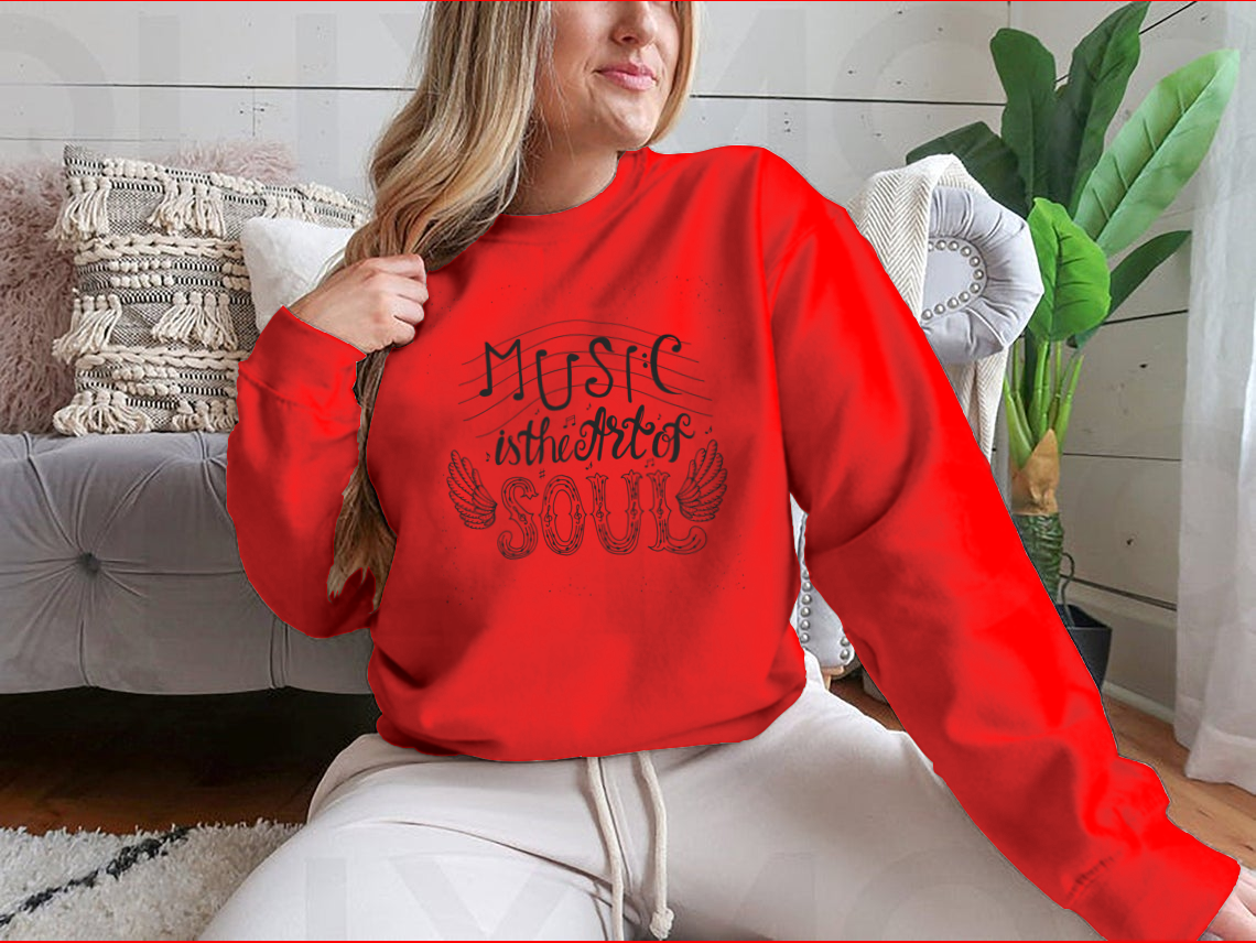 A cozy sweatshirt featuring the inspirational quote 'Music Is The Art Of Soul' designed for music lovers, showcasing a classic fit and soft fabric.