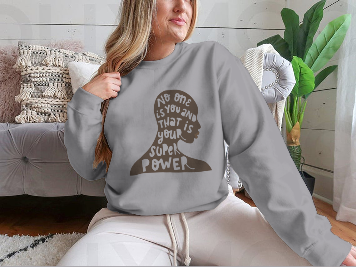 A soft cotton/polyester blend t-shirt featuring the inspirational quote 'No One Is You And That Is Your Super Power' in a stylish design.