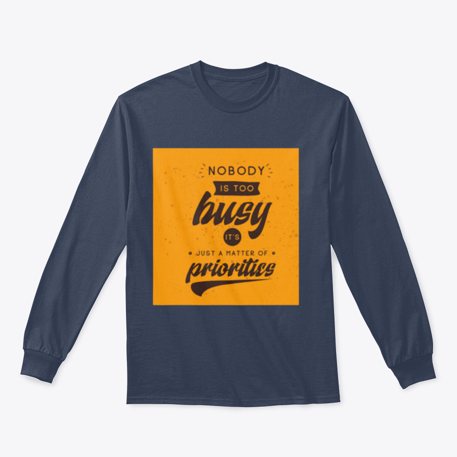 A motivational T-shirt featuring the quote 'Nobody Is Too Busy It's Just A Matter Of Priorities' in stylish typography, perfect for inspiring wearers.