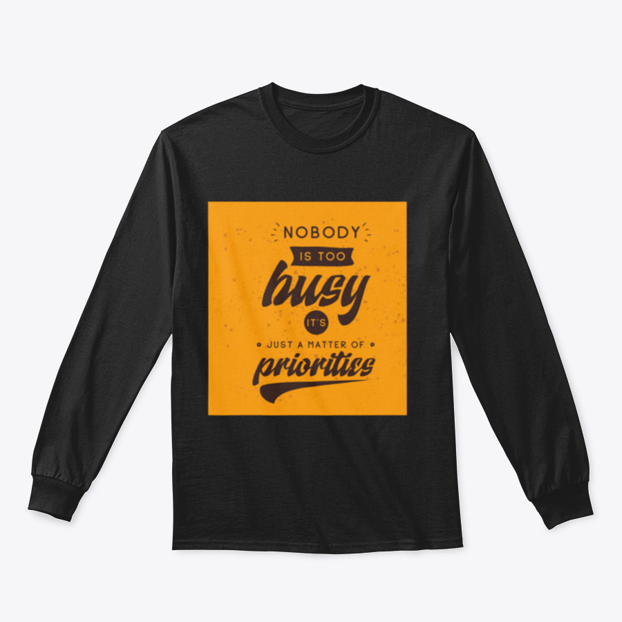 A motivational T-shirt featuring the quote 'Nobody Is Too Busy It's Just A Matter Of Priorities' in stylish typography, perfect for inspiring wearers.