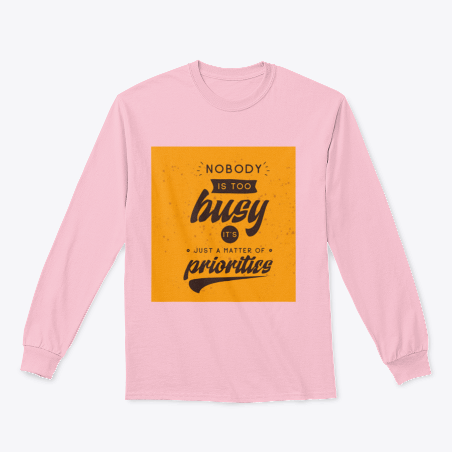 A motivational T-shirt featuring the quote 'Nobody Is Too Busy It's Just A Matter Of Priorities' in stylish typography, perfect for inspiring wearers.