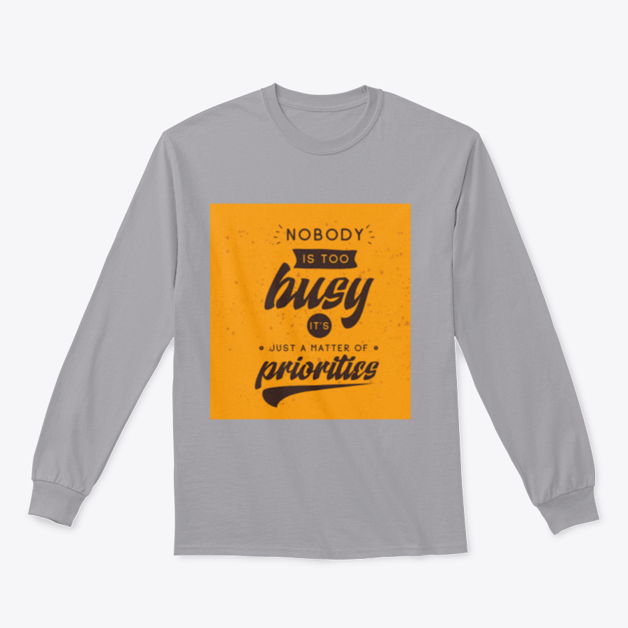 A motivational T-shirt featuring the quote 'Nobody Is Too Busy It's Just A Matter Of Priorities' in stylish typography, perfect for inspiring wearers.