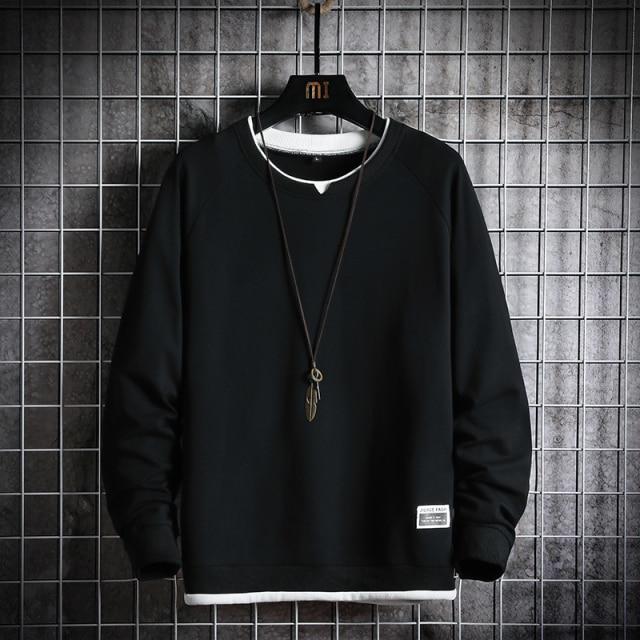 Oversized black sweatshirt by Aotorr featuring full sleeves and O-neck collar, perfect for casual wear.