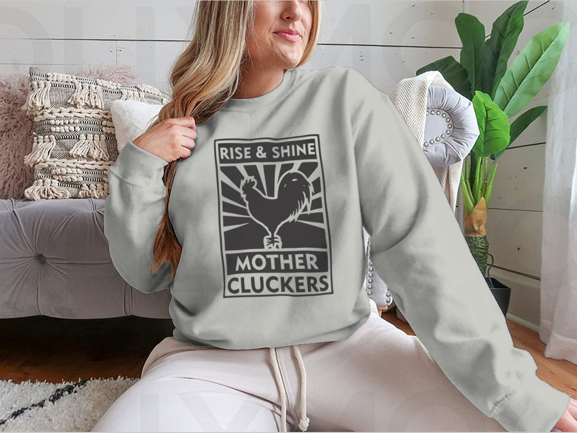 A stylish sweatshirt featuring the Rise And Shine Mother Cluckers logo, made from soft cotton fabric.