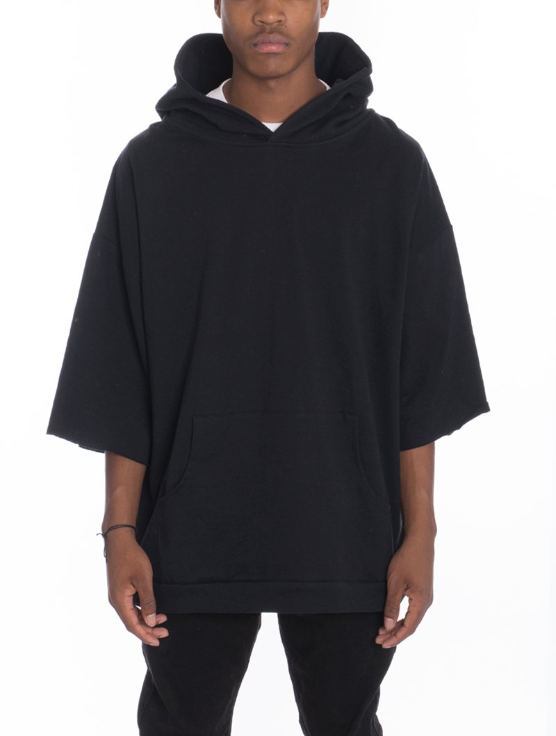 A stylish Short Sleeve Hood Tee featuring an oversized fit, hood, and kangaroo pocket, perfect for casual wear.