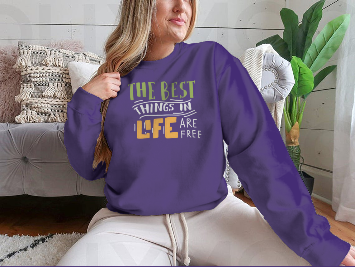 A stylish cotton shirt featuring the motivational quote 'The Best Things In Life Are Free' in elegant hand lettering design.